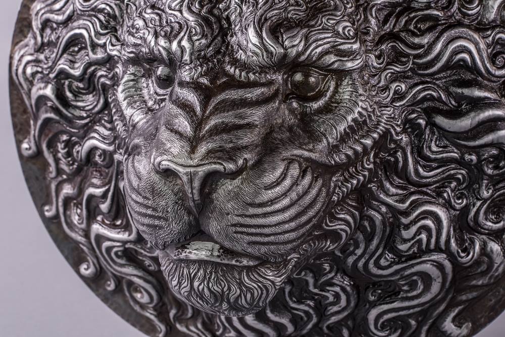 a metal lion head close up