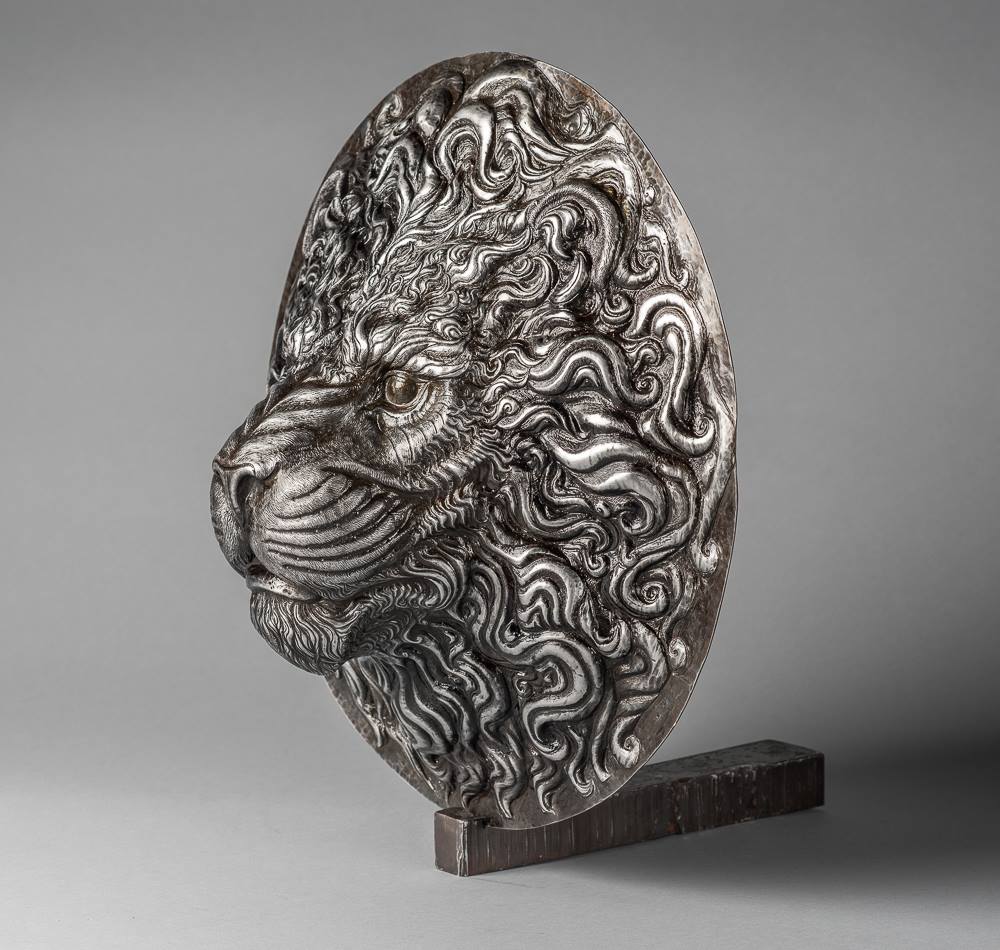 a metal lion head side view
