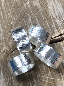 four silver metal rings