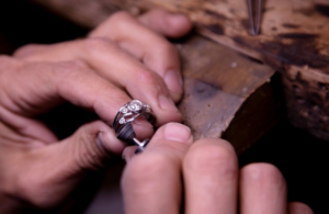 A person is working on a ring